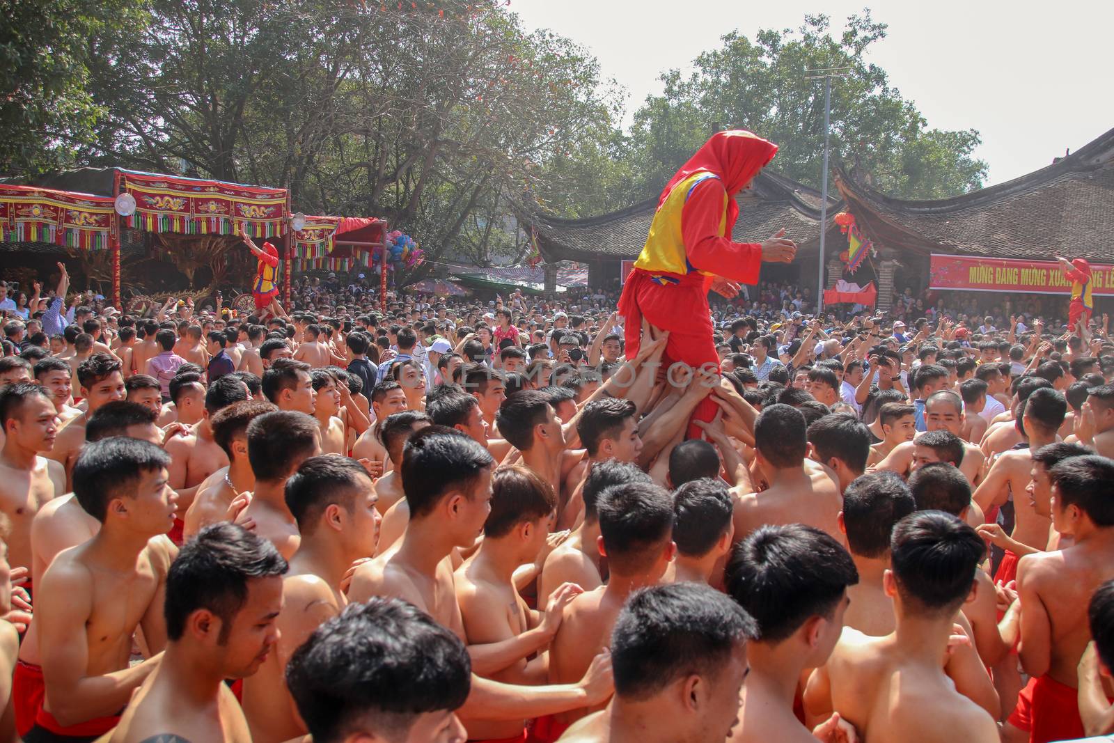 Editorial. Crowd of Vietnamese people celebrating the annual Dong Ky Firecracker Festival in Bac Ninh, Vietnam