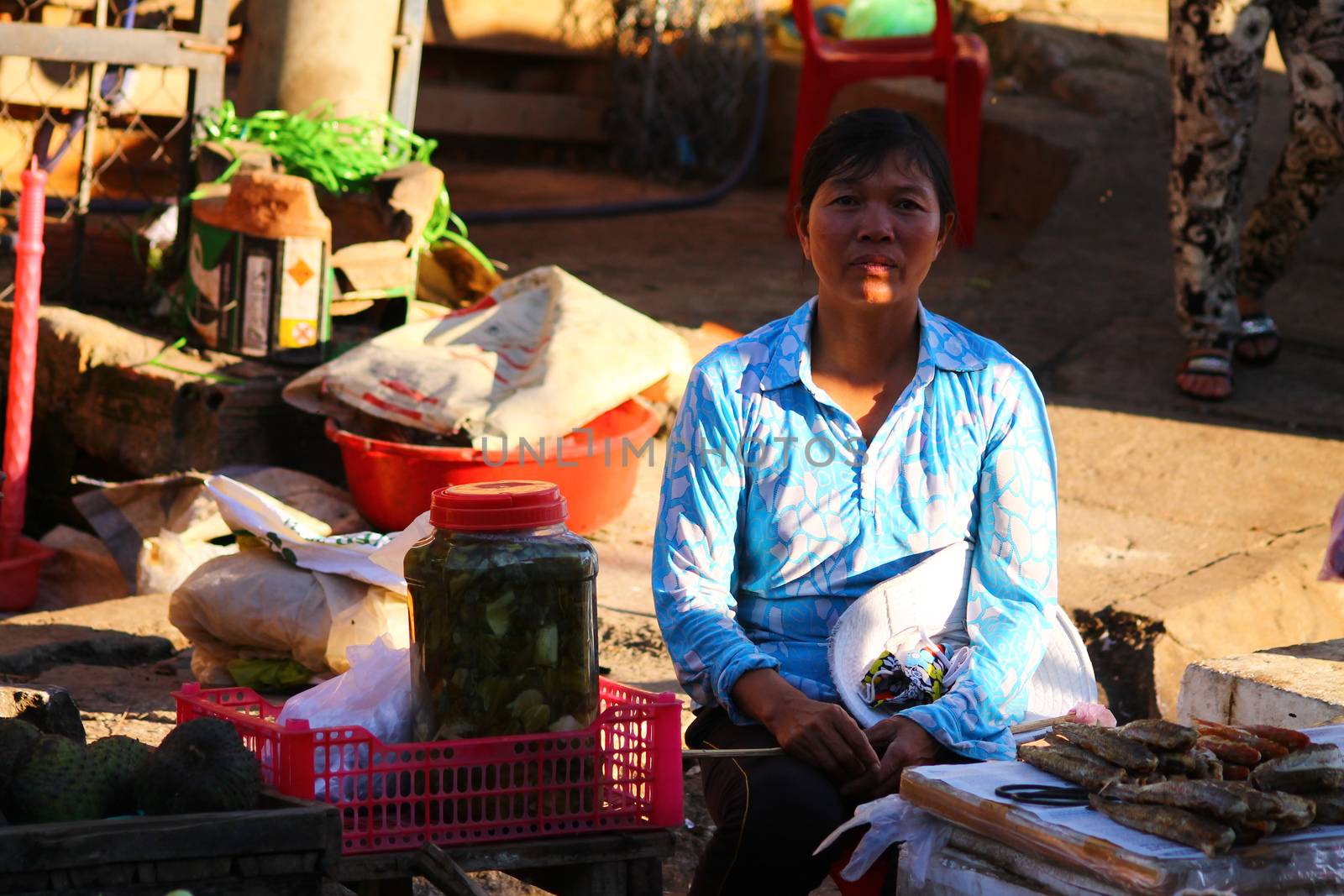 Editorial. Vietnamese woman selling fresh produce on the side of the street in Quy Nhon, Vietnam