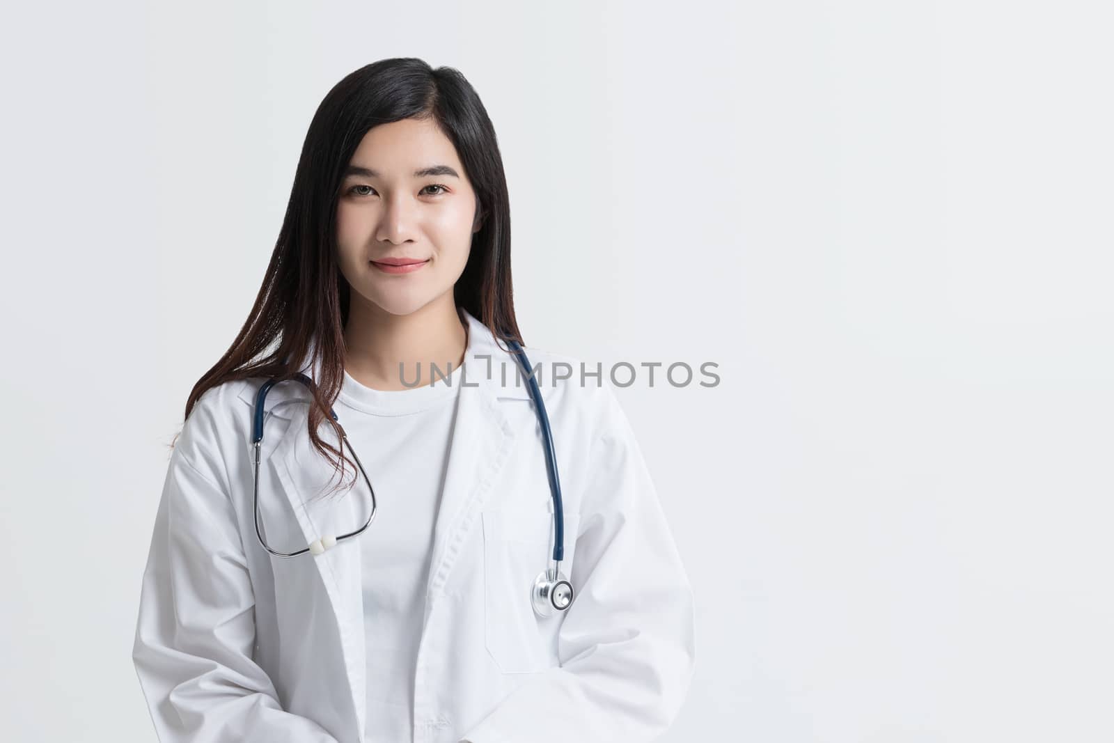 attractive Asian female doctor looking at camera with smiling fa by asiandelight