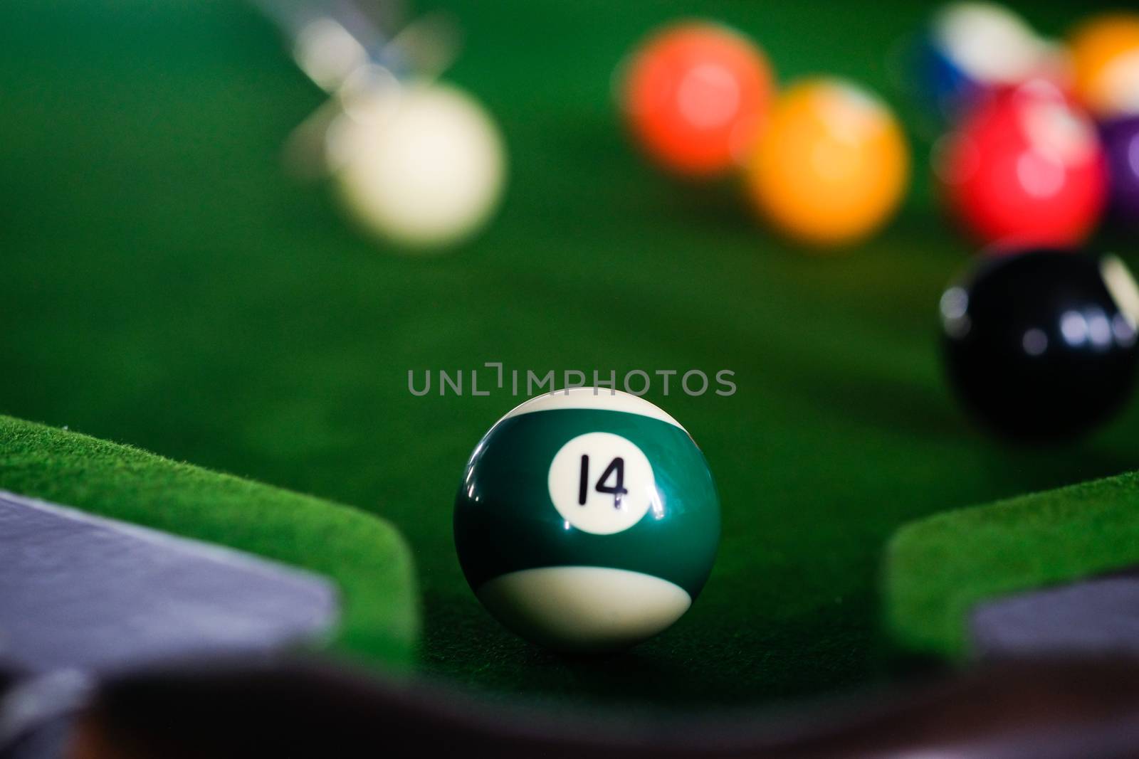 Man's hand and Cue arm playing snooker game or preparing aiming  by peandben