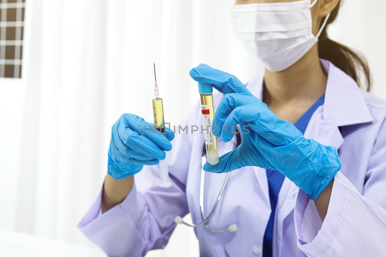 Hand holding syringe and vaccine treatment from Coronavirus covi by peandben