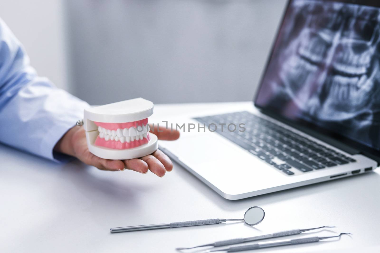 Dentist examining a patient teeth medical treatment at the denta by peandben