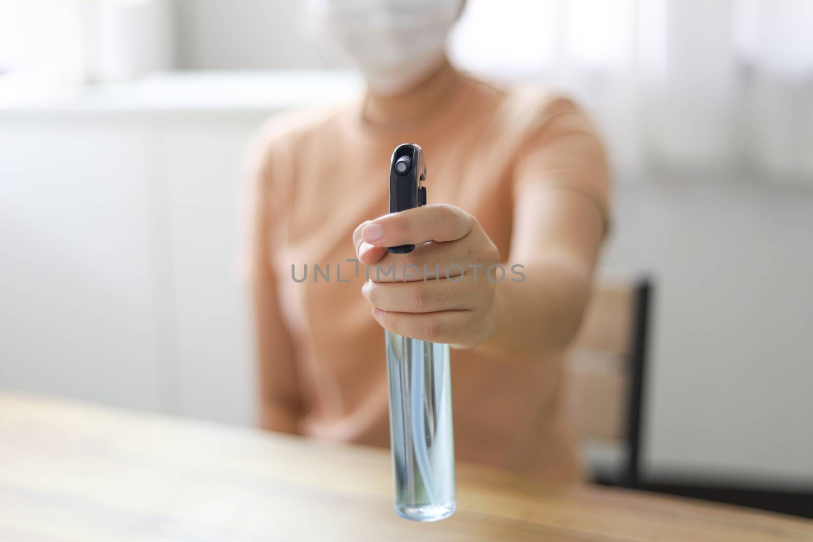 Woman spraying alcohol Anti-Bacterial Sanitizer disinfectant. sp by peandben