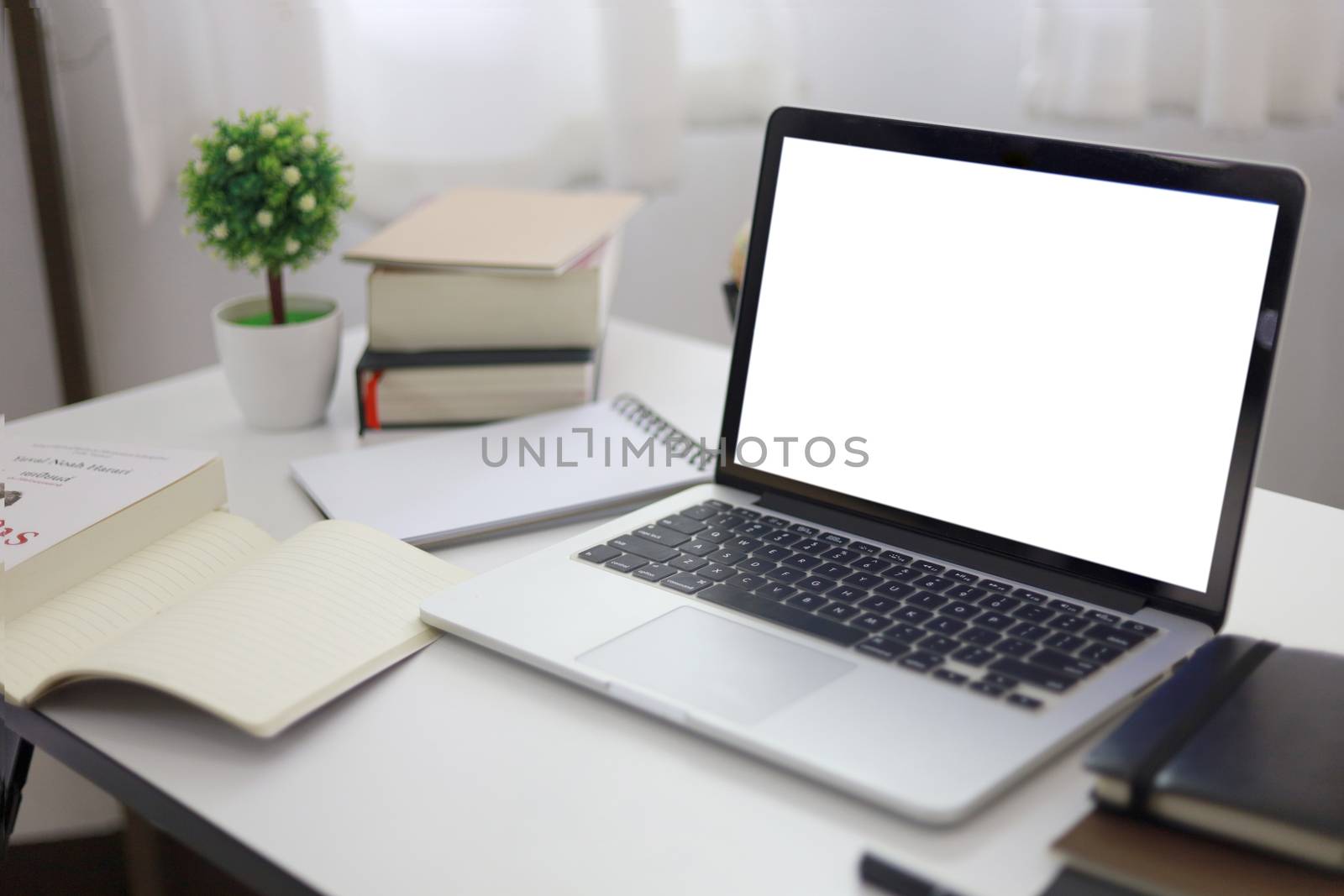 Laptop with Mock up blank screen on wooden table in front of cof by peandben