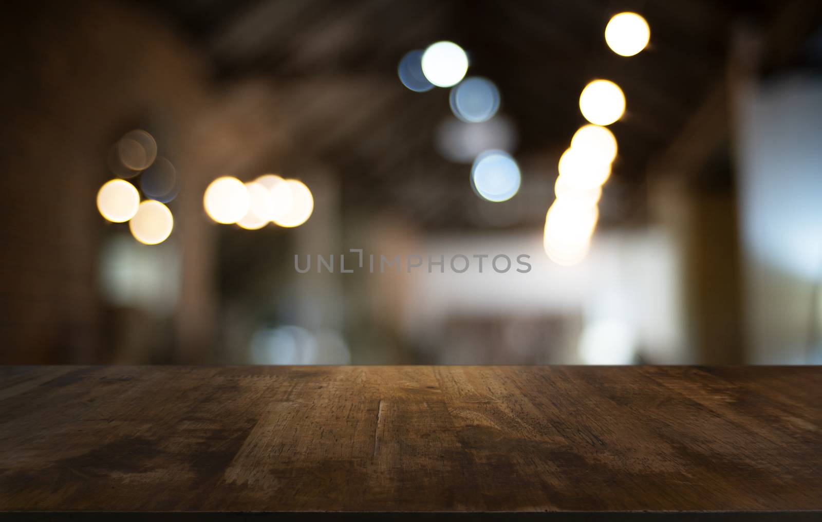 Wood Table Top in Blur Background room interior with empty copy  by peandben