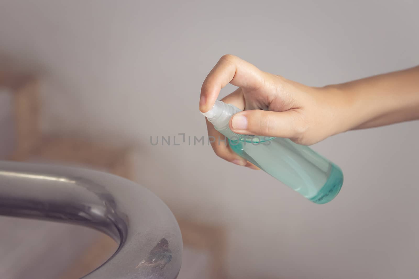 disinfect, sanitize, hygiene care. cleaning staff using alcohol spray on banister and frequently touched area for cleaning and disinfection, prevention of germs spreading during infections of COVID-19