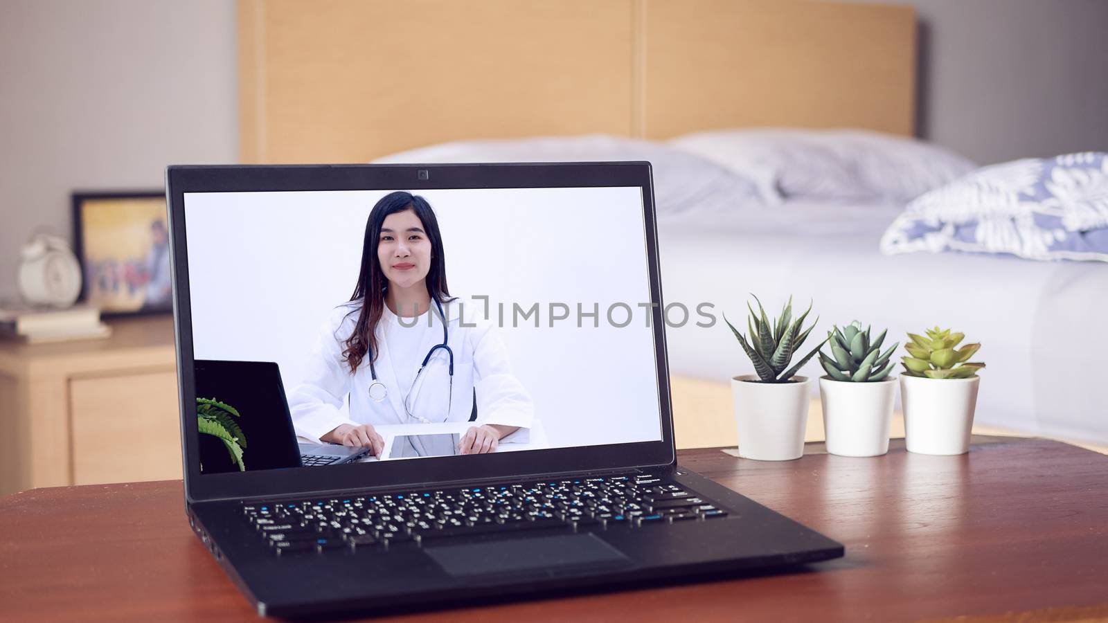 Asian doctor provide health consultation services through website for online consultation via laptop computer, about illness and medication via video call. Telehealth, Telemedicine and online hospital