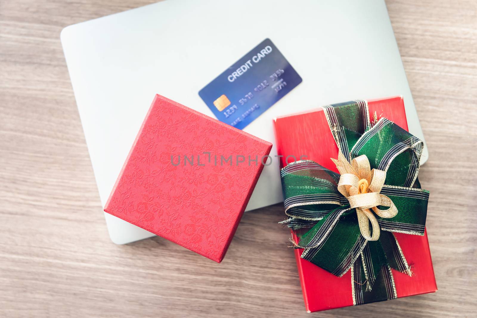 Shopping Online and Holiday Celebration Concept, Present Gift Box and Credit Card on Laptop. Celebrate Anniversary Greeting Presents Event