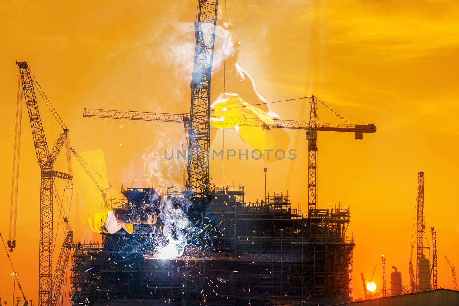 Double Exposure of Welder is Welding Pipeline Fabrication Assembly With Oil Rig Platform Background. Technician Welding in Safety Protective Equipment is Working Metalwork in Construction Site. by MahaHeang245789