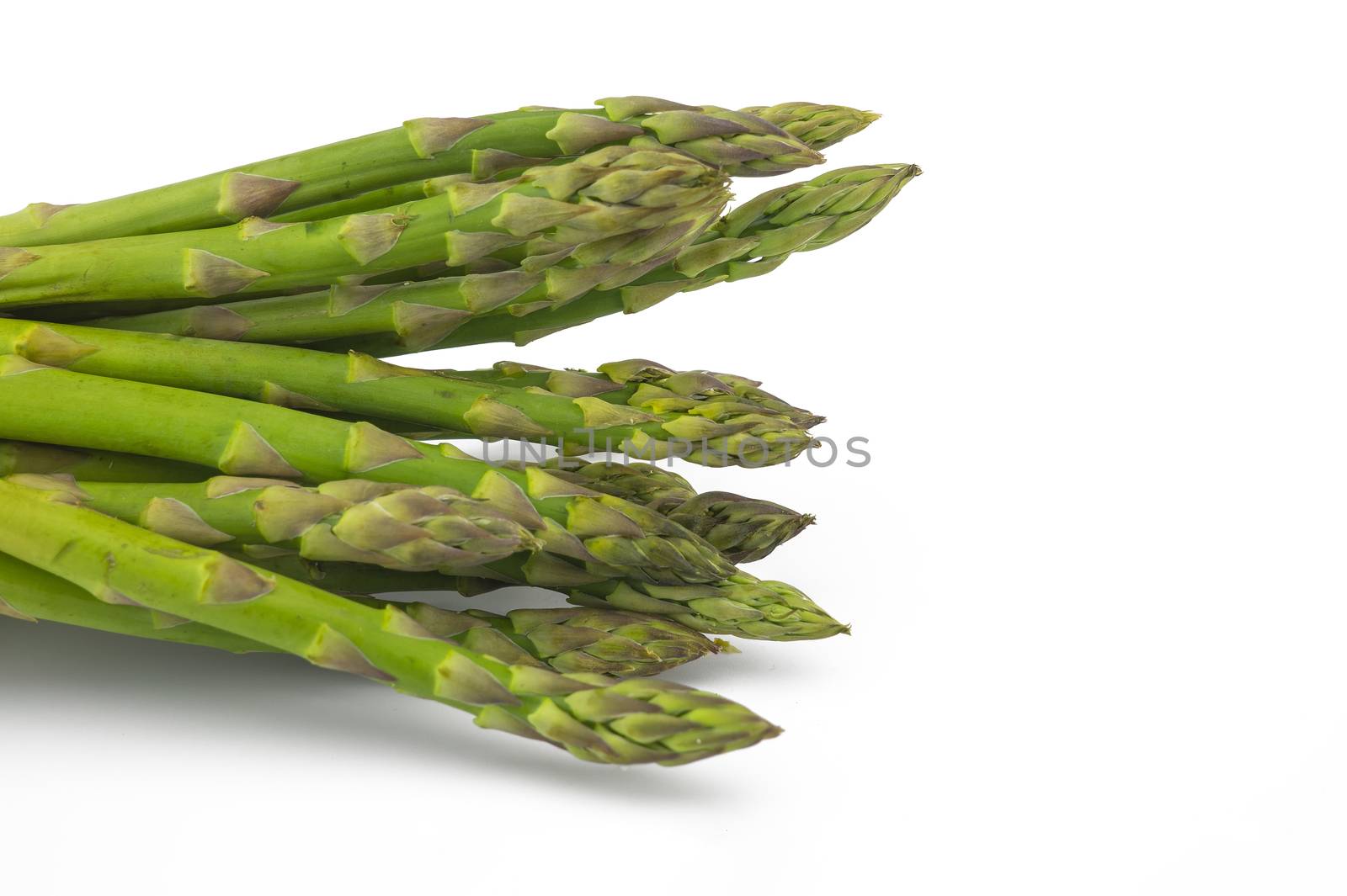 Bunch of fresh green asparagus isolated on white background