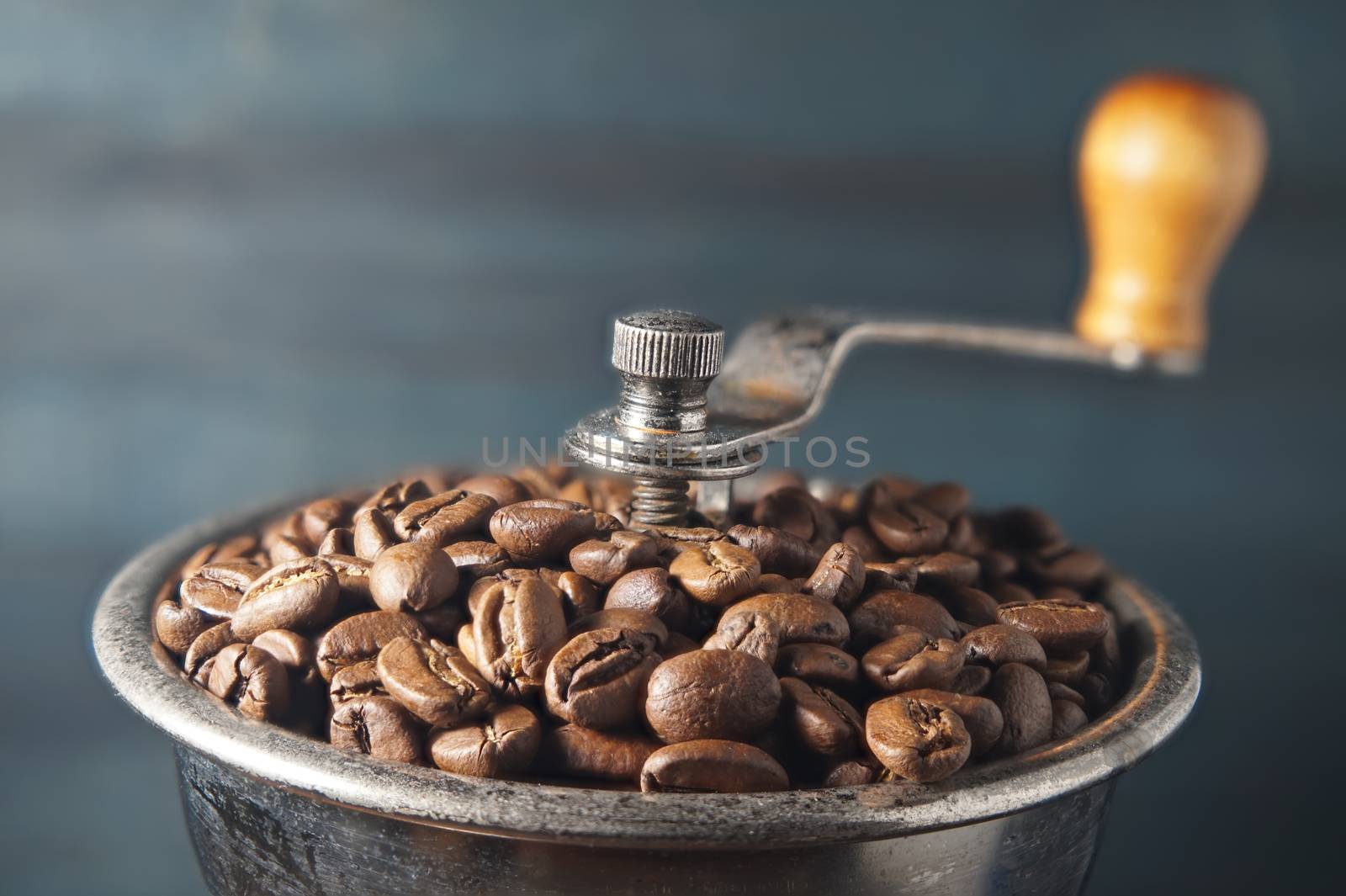 Close up coffee beans in manual coffee grinder