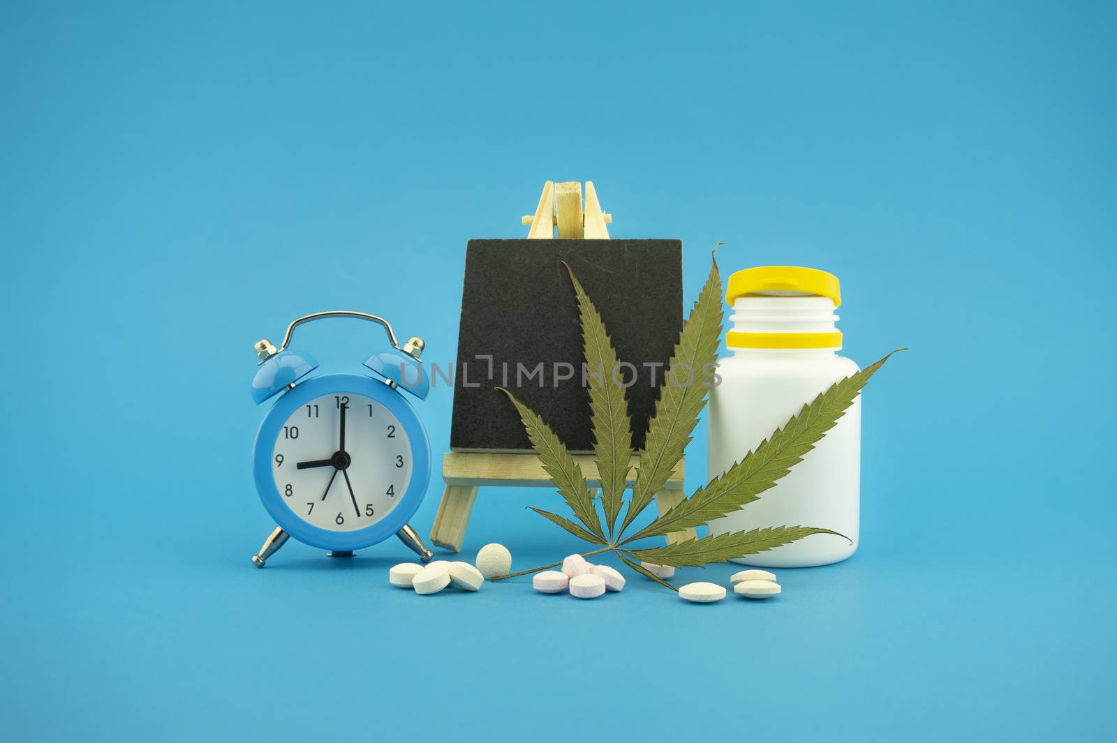 Medicinal marijuana concept with fresh green leaf by NetPix