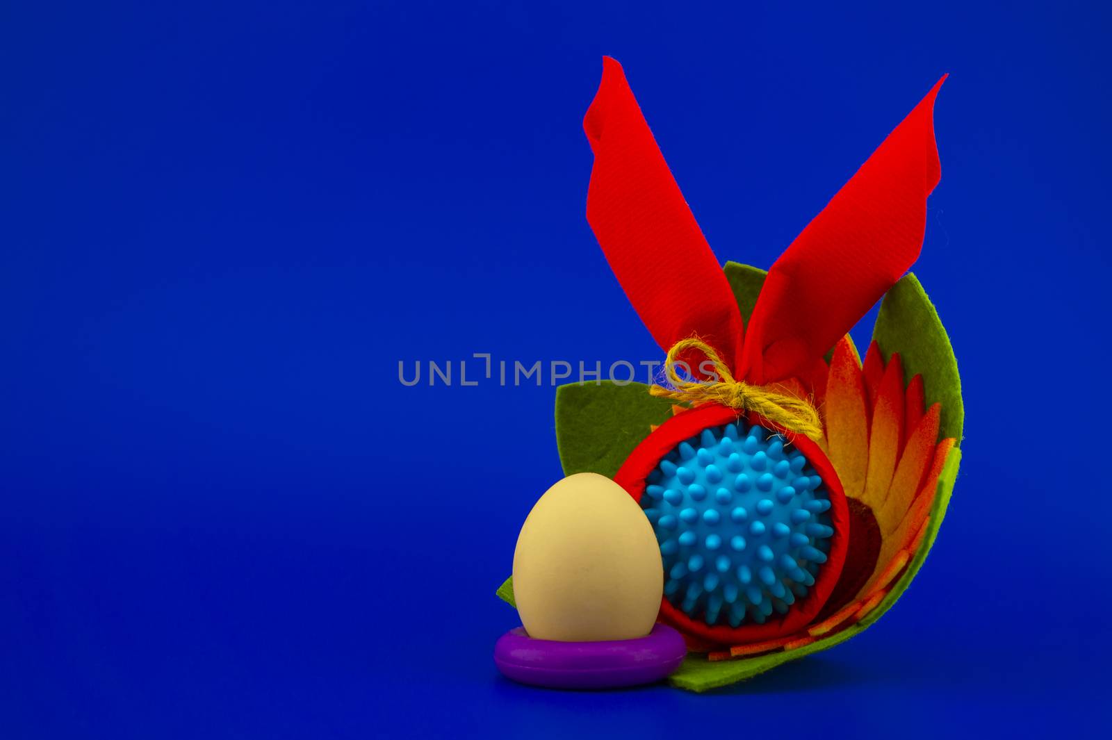 Corona virus models wrapped as gifts and Easter eggs on a blue background with copy space