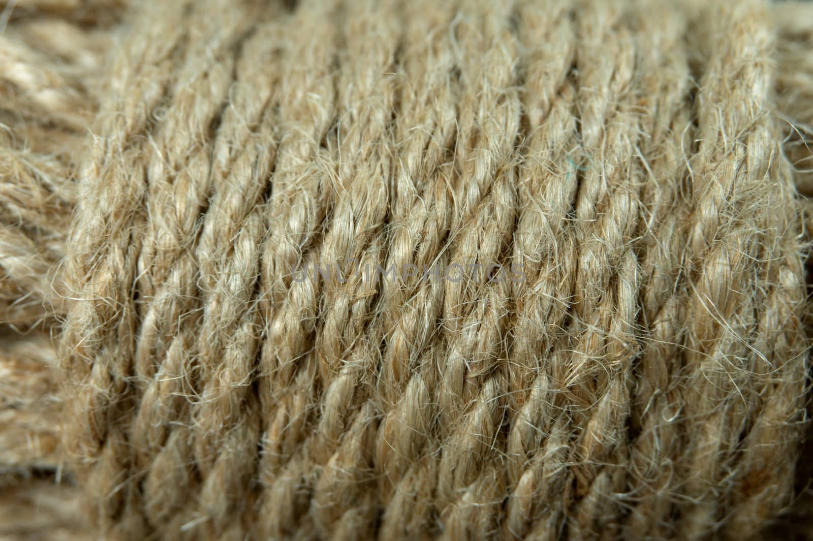 Jute twine in close-up on grey rustic background