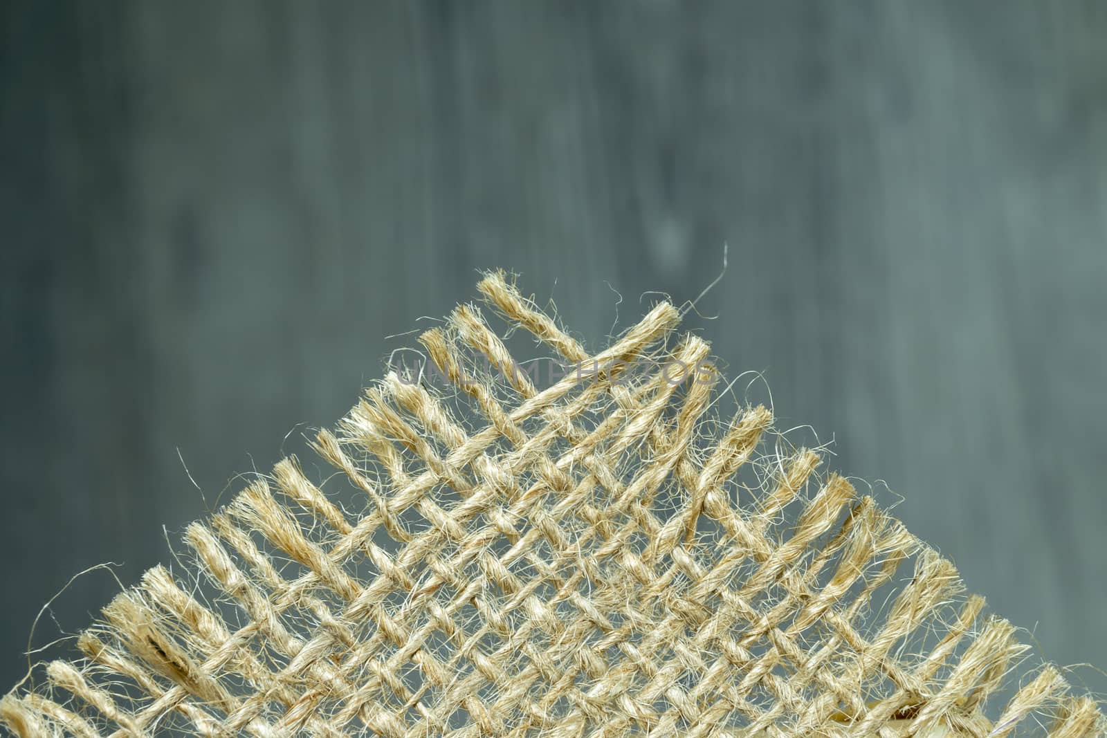 Jute fabric in close-up on grey rustic background