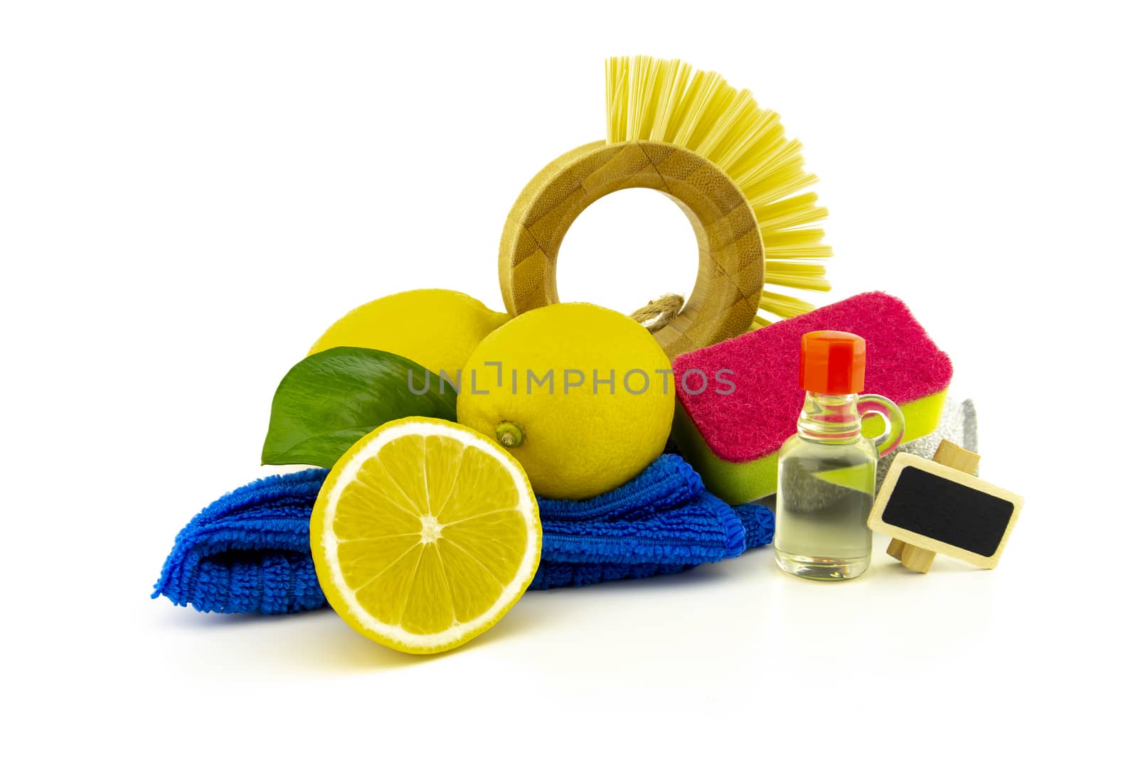 Home cleaning means, such as brush, cloth, foam sponge, acid and lemons for stain removal and freshness. Studio shot isolated on white background