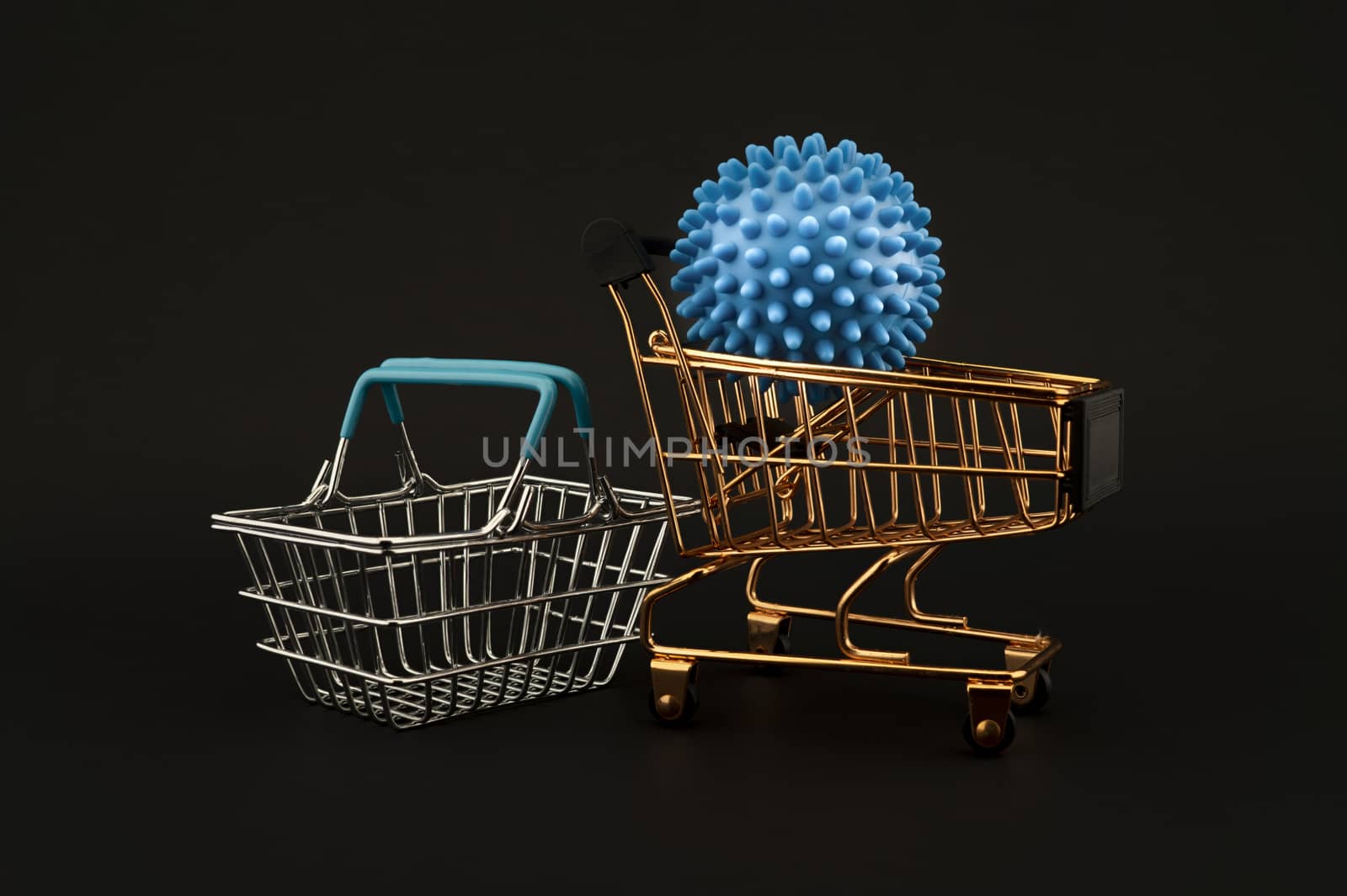 Blue virus molecule on a shopping cart and basket conceptual of the possibility of infection with corona virus or Covid-19 over a black background