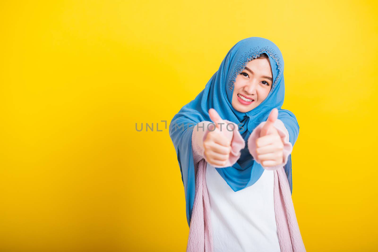 Asian Muslim Arab woman Islam wear hijab she made finger thumbs  by Sorapop