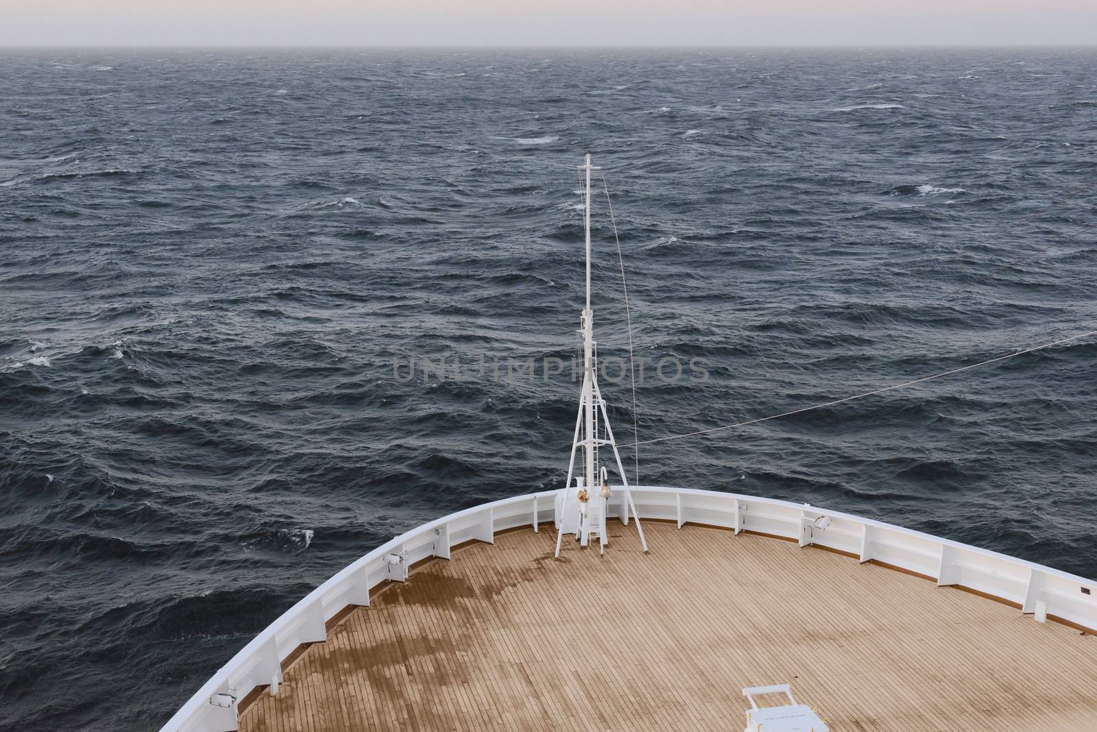 Ship Sailing In Open Sea At Sunset