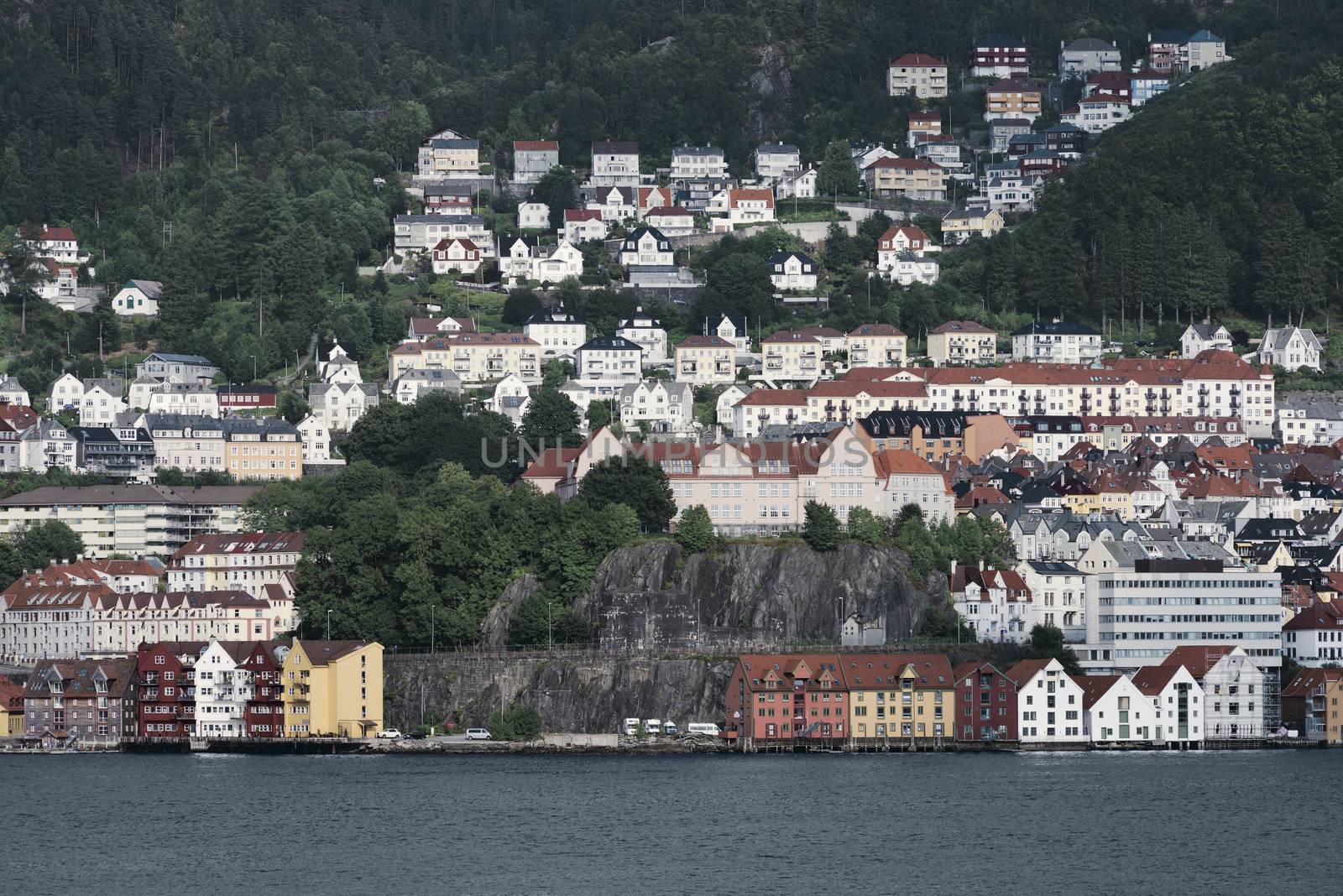 Wooden Colored Houses On The Background Of Mountains, Bergen, Norway