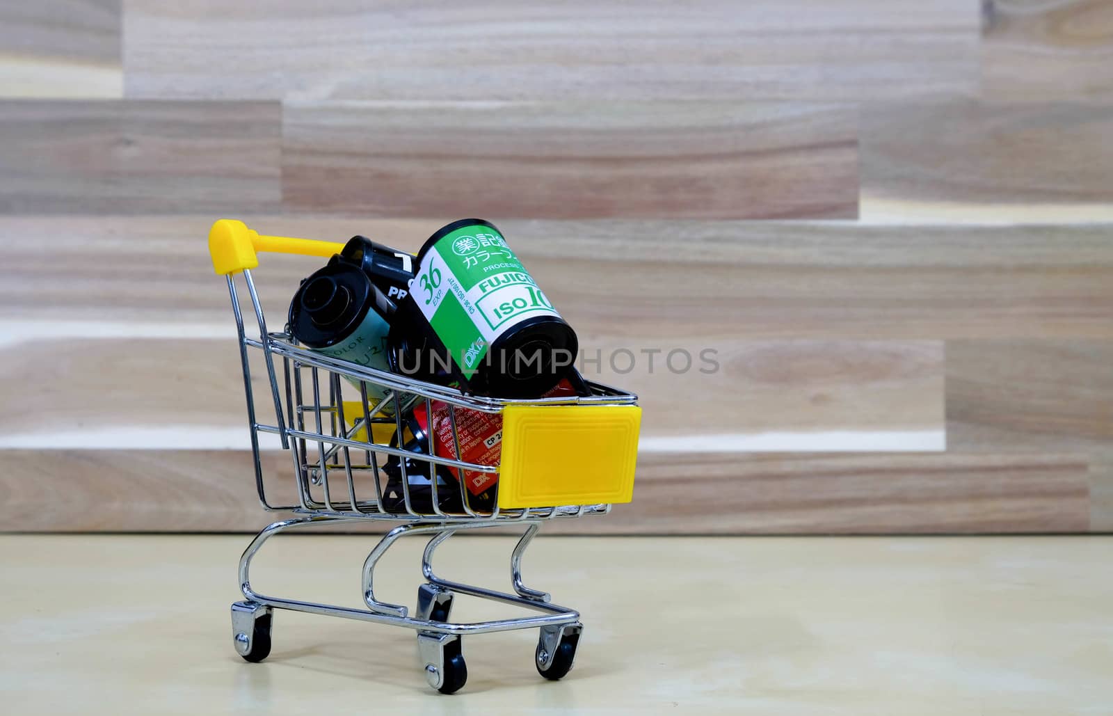 A Group of Film in The Market Cart on Wooden Background