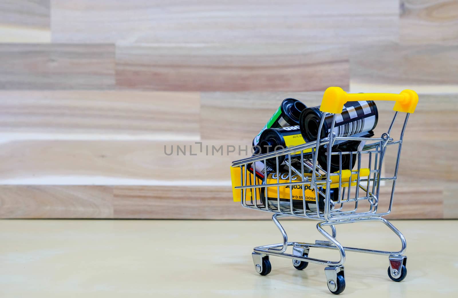 A Group of Film in The Market Cart on Wooden Background by Bonn2210