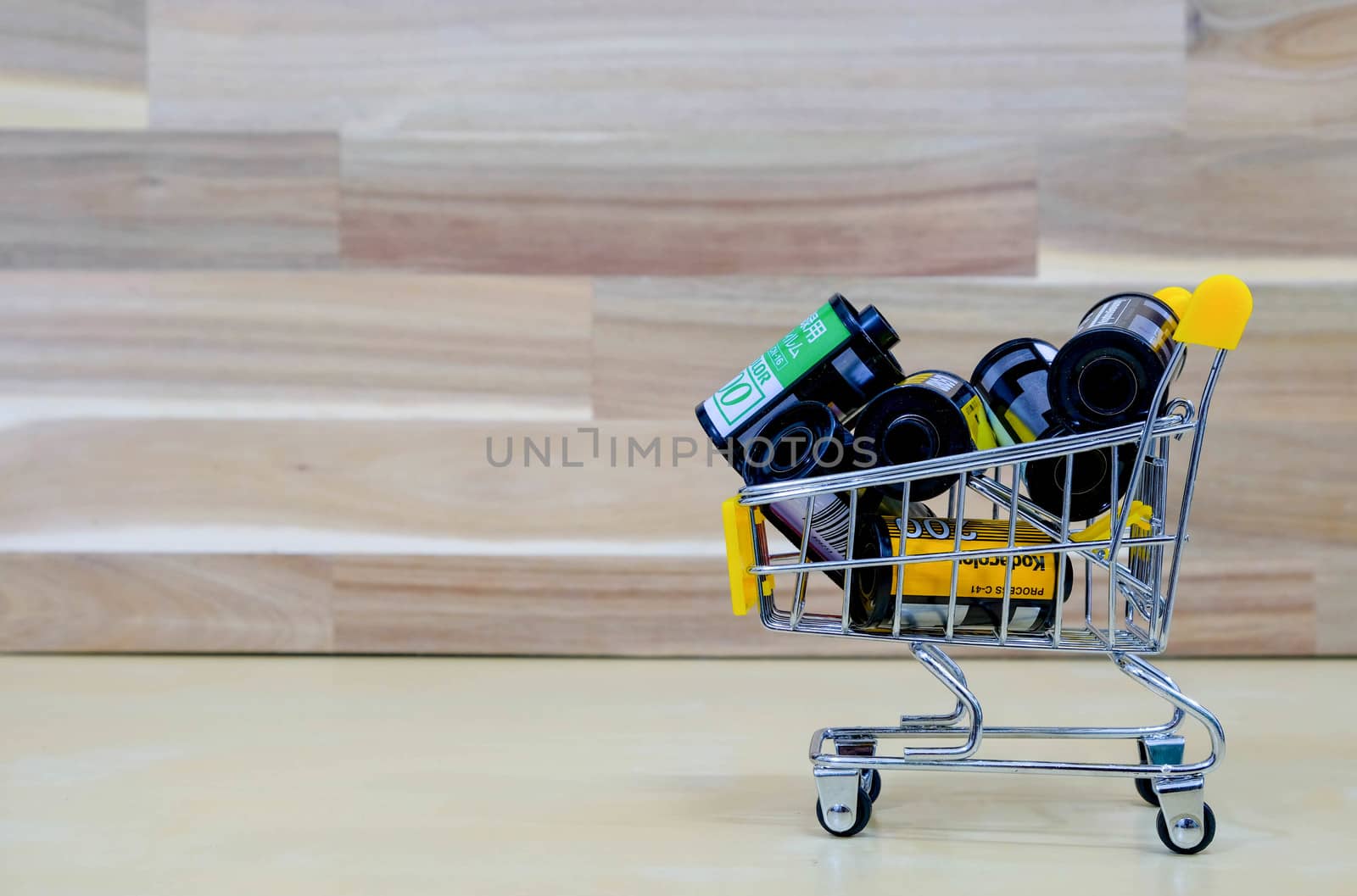 A Group of Film in The Market Cart on Wooden Background