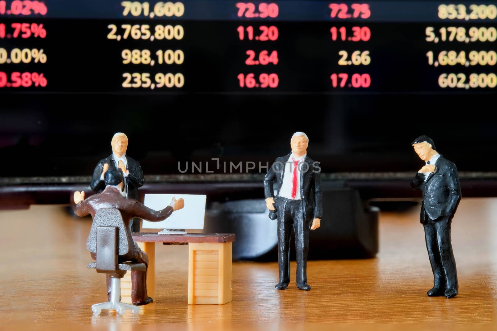 Miniature figure business people or Stock Trader looking at Blur by Bonn2210