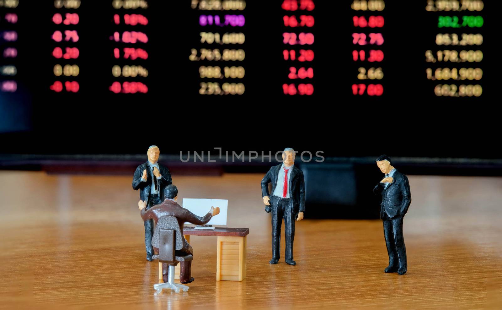 Miniature figure business people or Stock Trader looking at Blur by Bonn2210