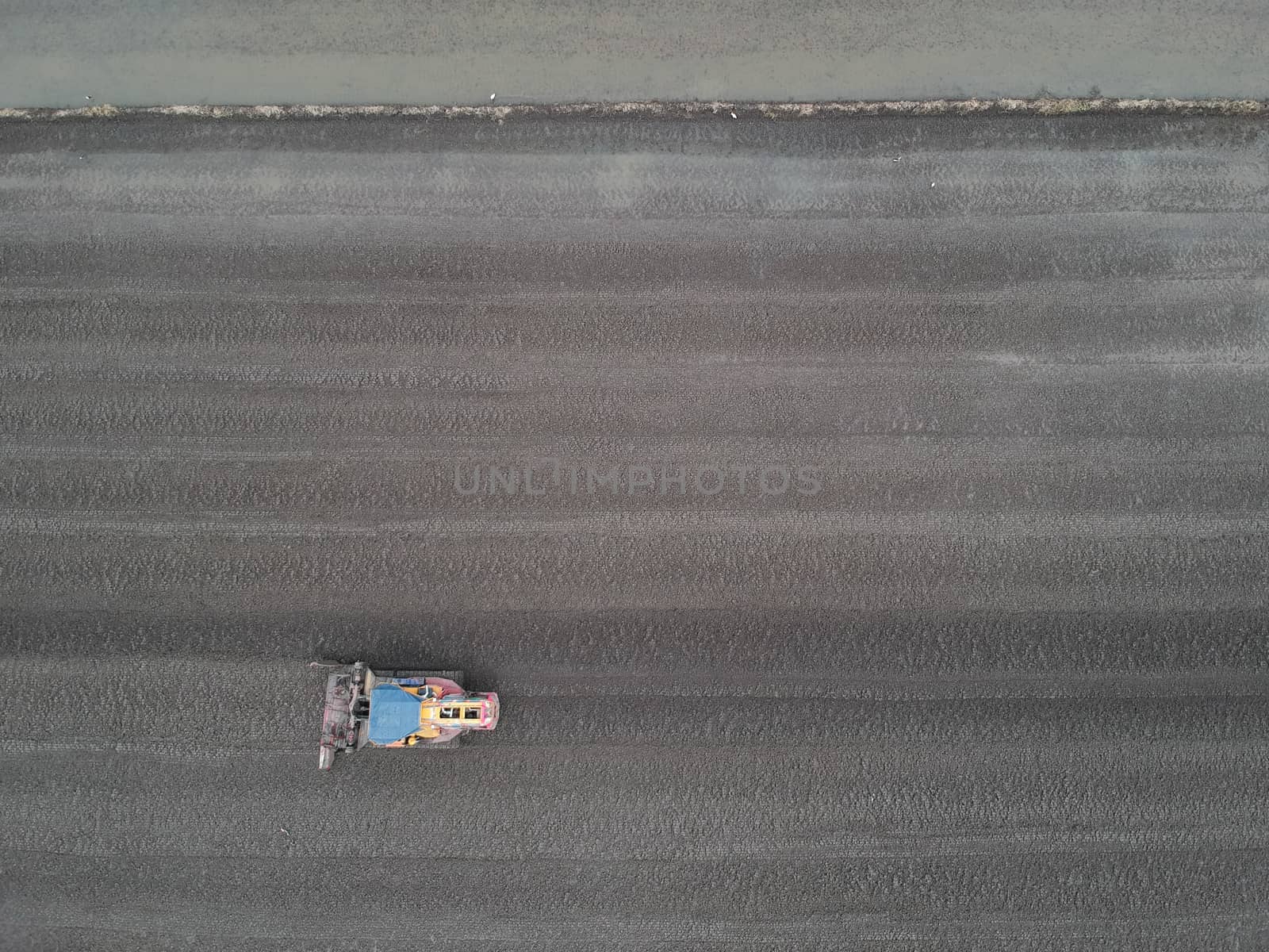 Rice tractor, rice field scene,Aerial view