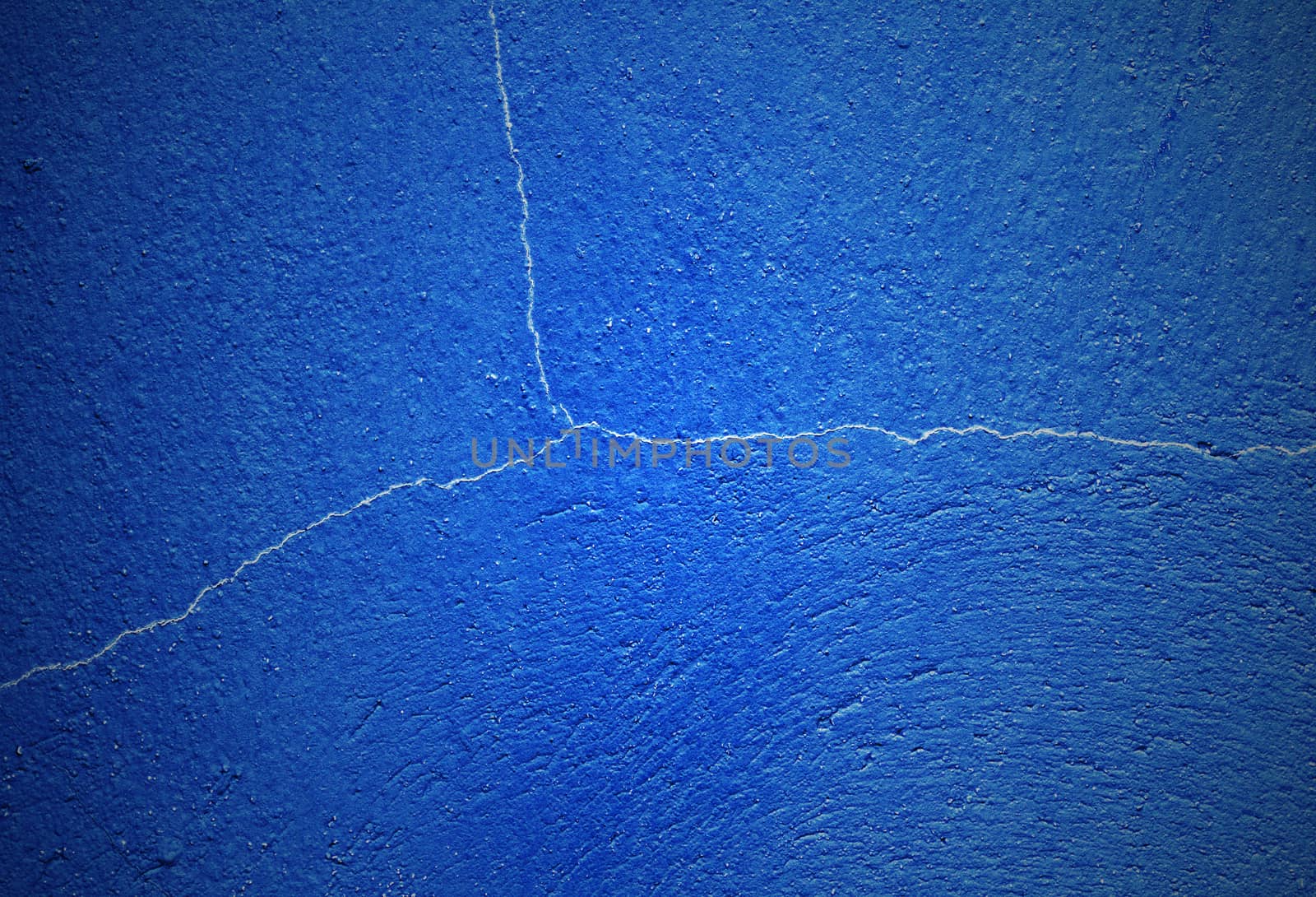 Crack dark blue concrete wall background, vintage and retro style
