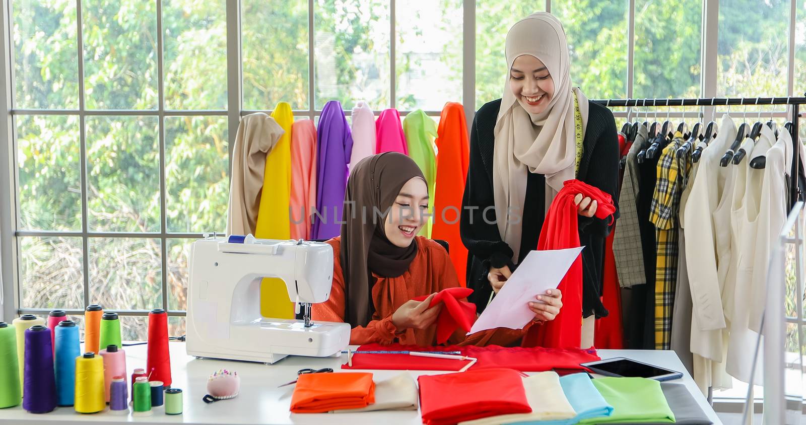 Small business of Muslim woman fashion designer Working and  usi by Tuiphotoengineer