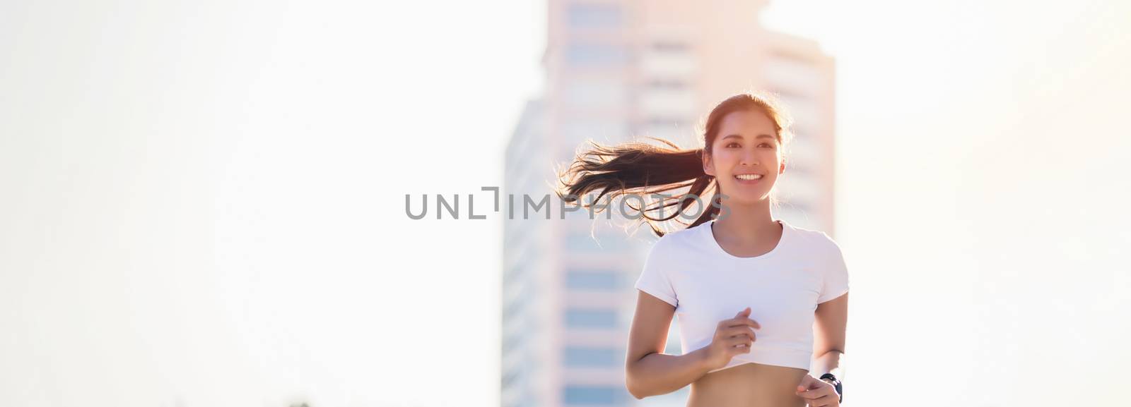 smiling Asian Young fitness sport woman running  and Sportive pe by Tuiphotoengineer