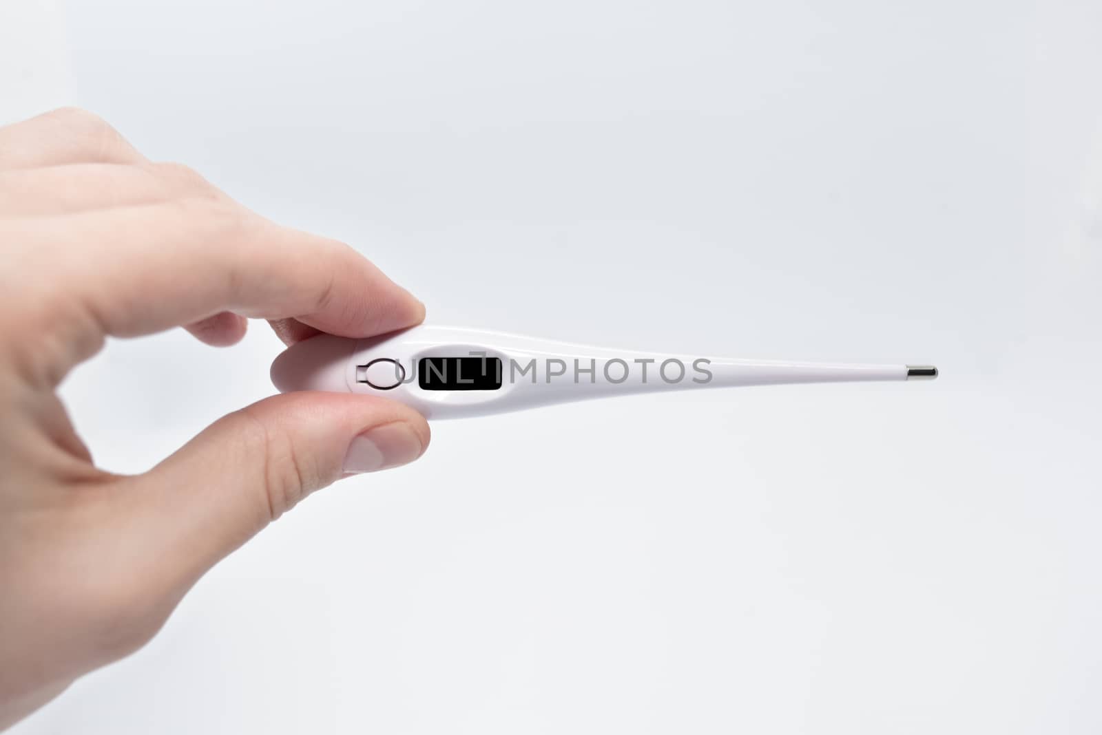 Man holding a digital thermometer with white button isolated on white background