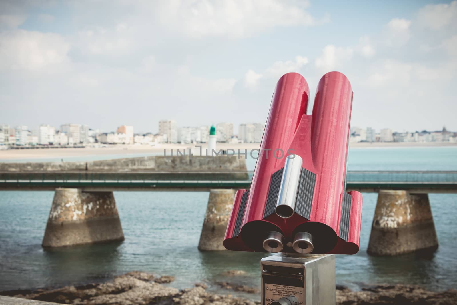 Sables d Olonne, France - October 13, 2015 : binocular telescope for tourist pointed to the beach on a fall day
