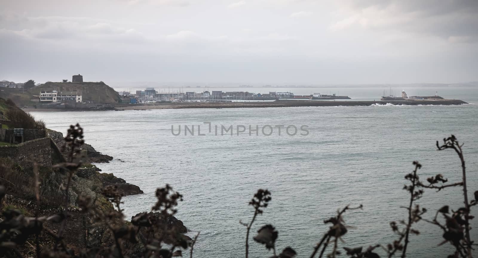 Distant view of a small touristy fishing port near Dublin on a winter day