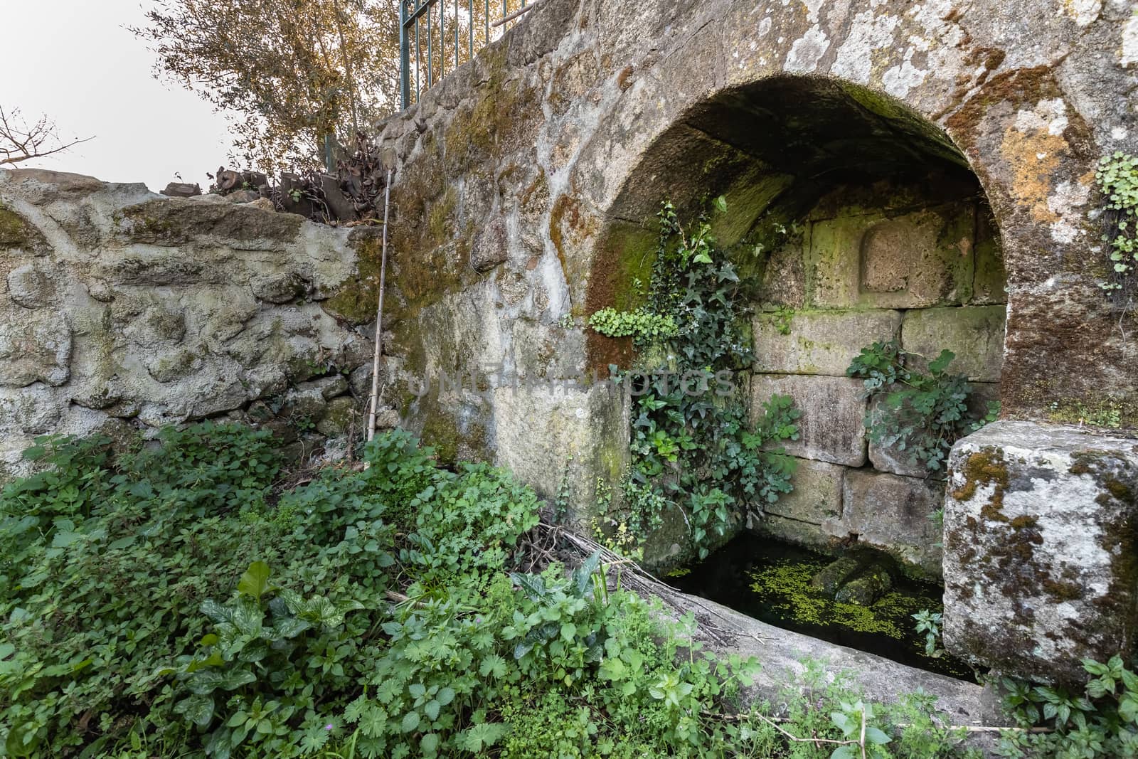 old stone water source in portugal  - ancient well by AtlanticEUROSTOXX