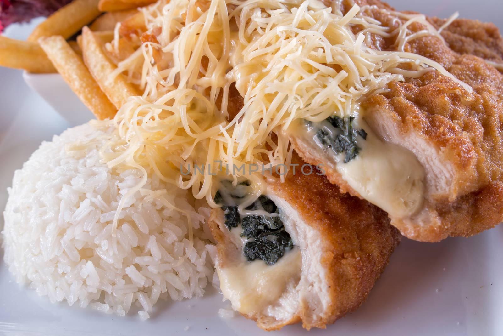 Stuffed schnitzel with french fries and rice,cheese