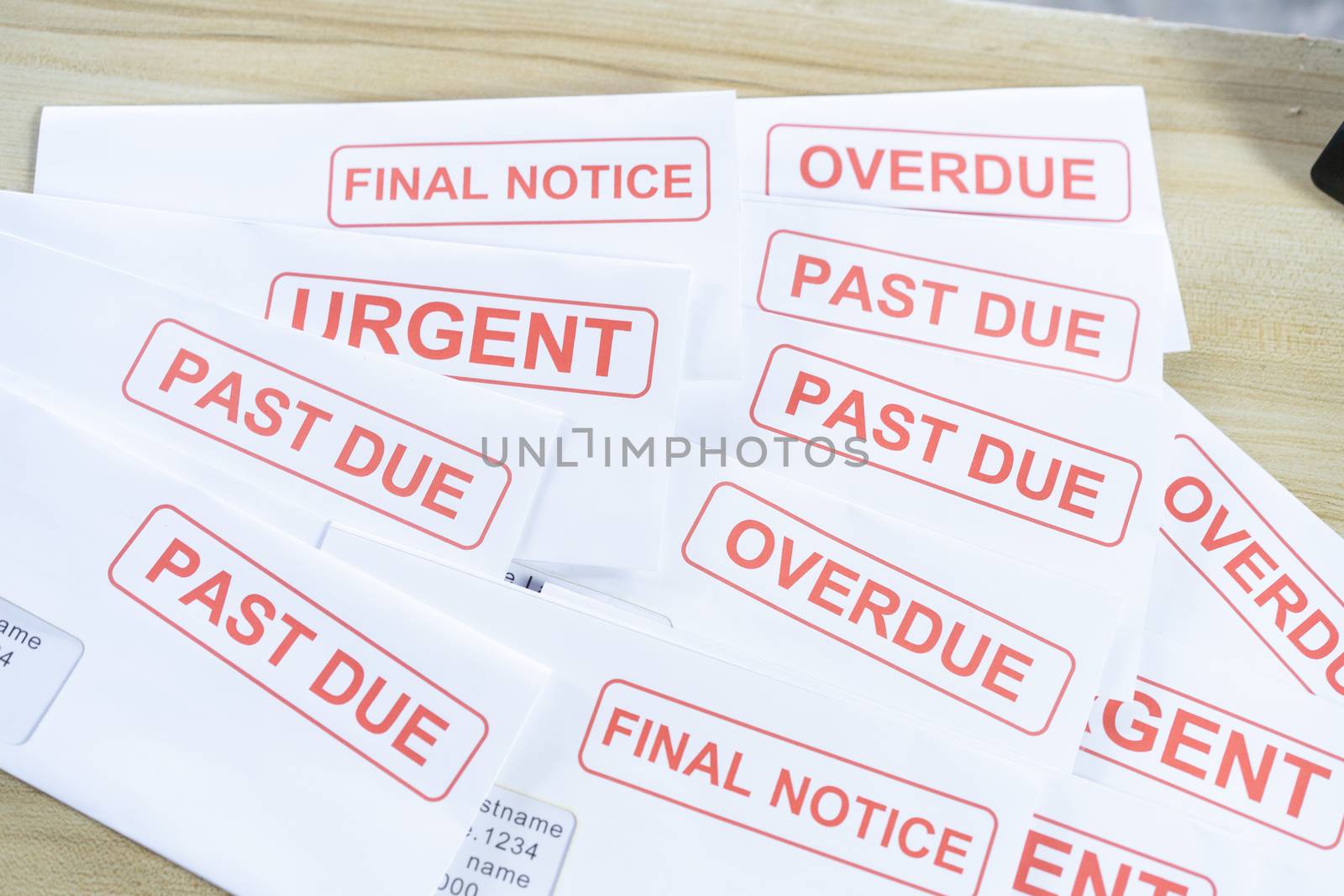Outstanding invoices are placed on the table.