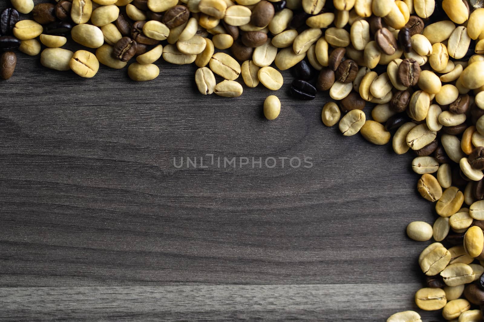 Coffee beans. Coffee beans that have not been baked on the wood floor.