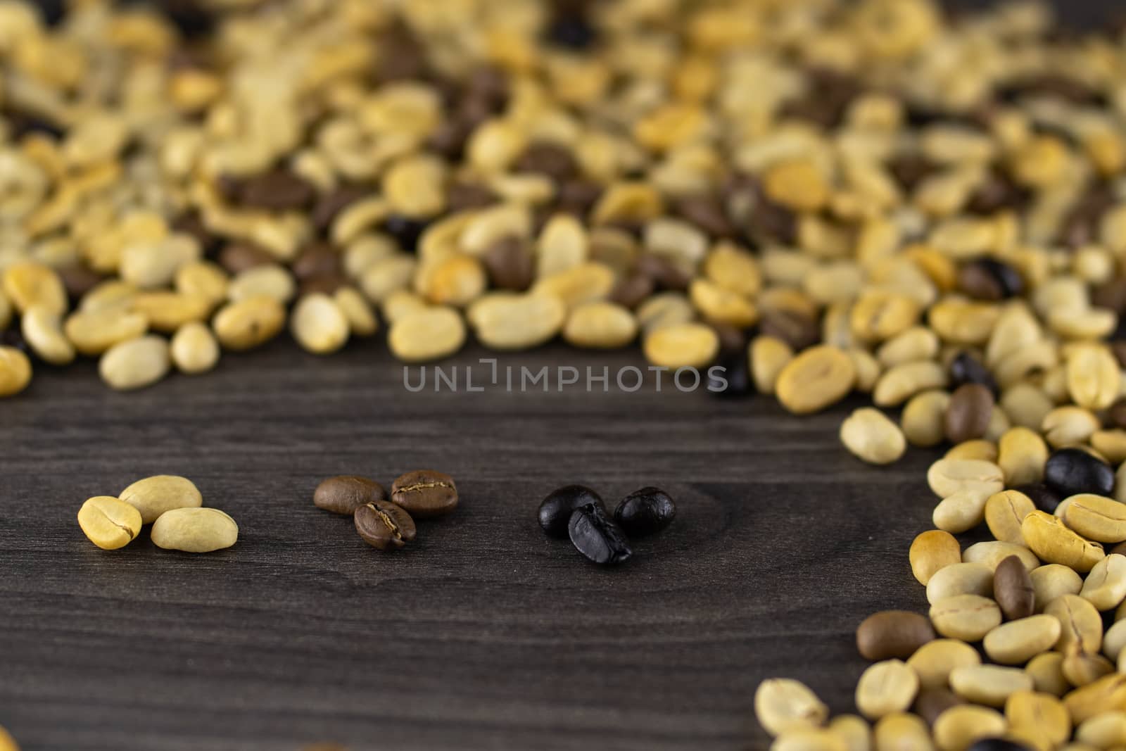 Striped coffee beans isolated in a wooden background