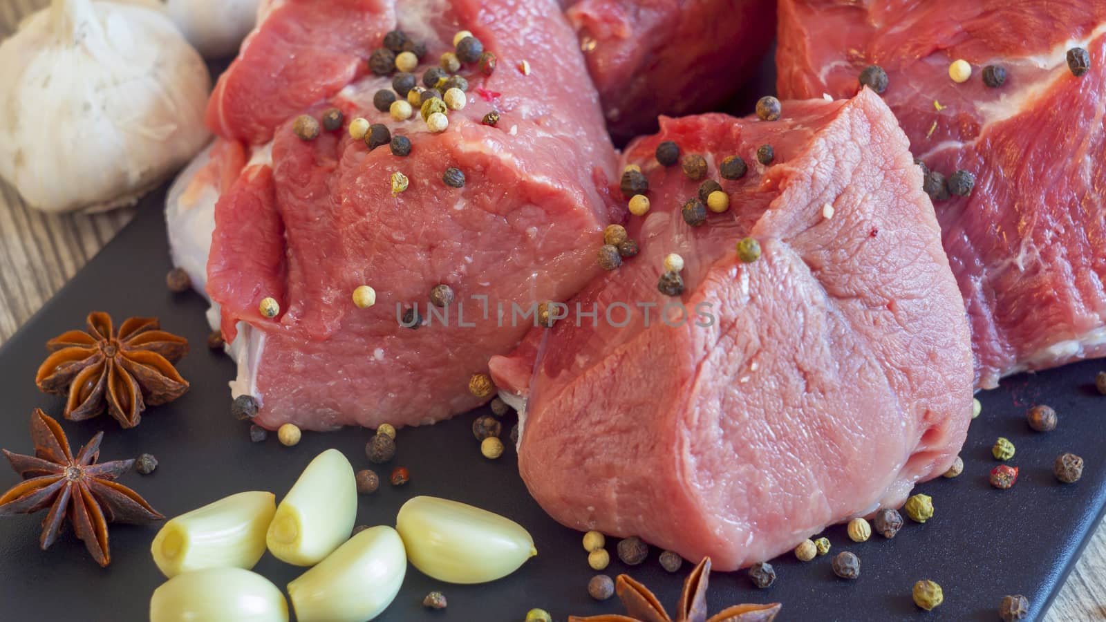 Meat dishes are prepared in the restaurant by the chef. Organic meat from the farm. Pork from the farm sprinkled with spices and spices.