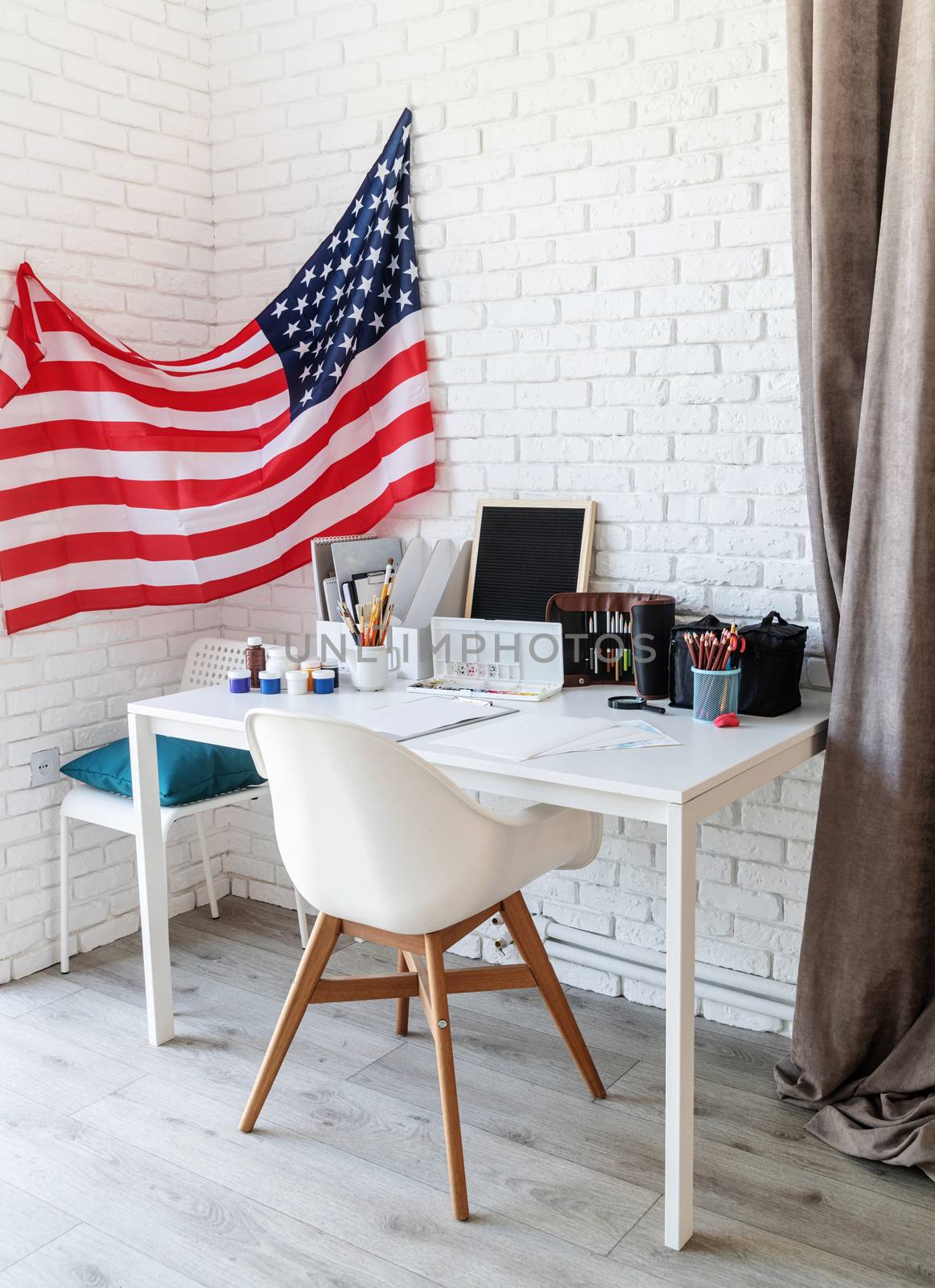 Artist desk and workspace with the US flag by Desperada