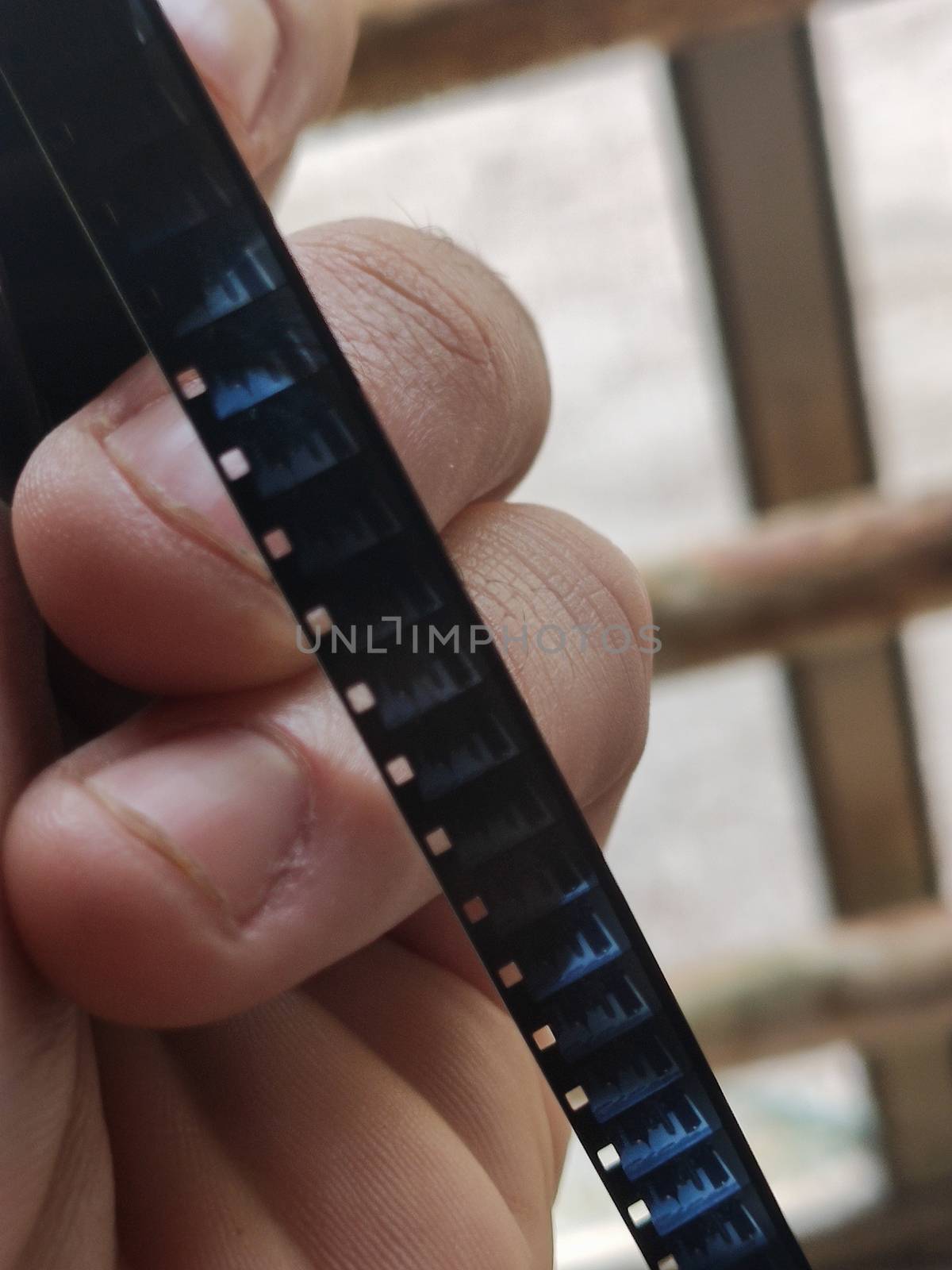 Old 8mm film taken in hand in macro detail