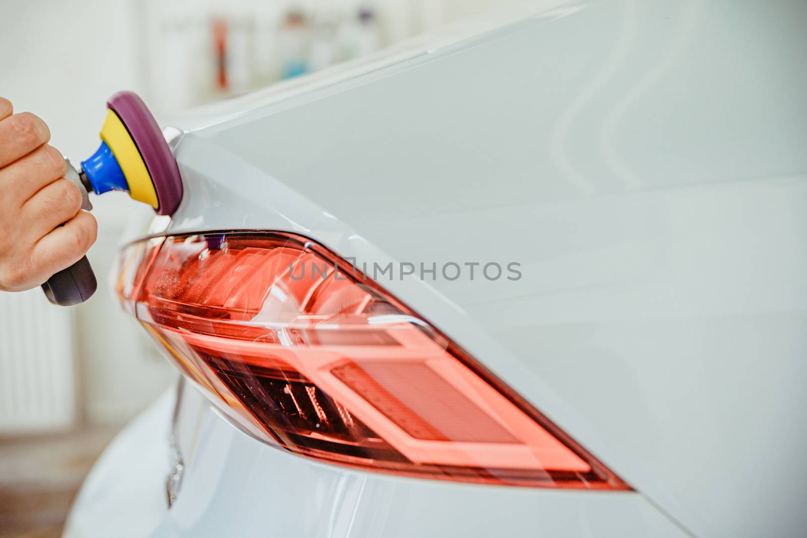 manual polishing of the body of luxury cars with the application of ceramic protective equipment. copy space by Edophoto