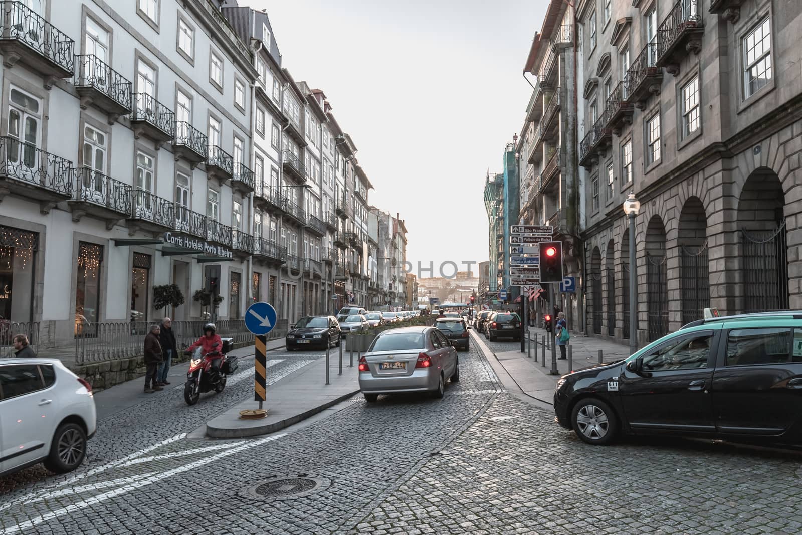 Porto, Portugal - November 30, 2018: Architecture detail and street atmosphere in the historic city center where people walk on a winter day