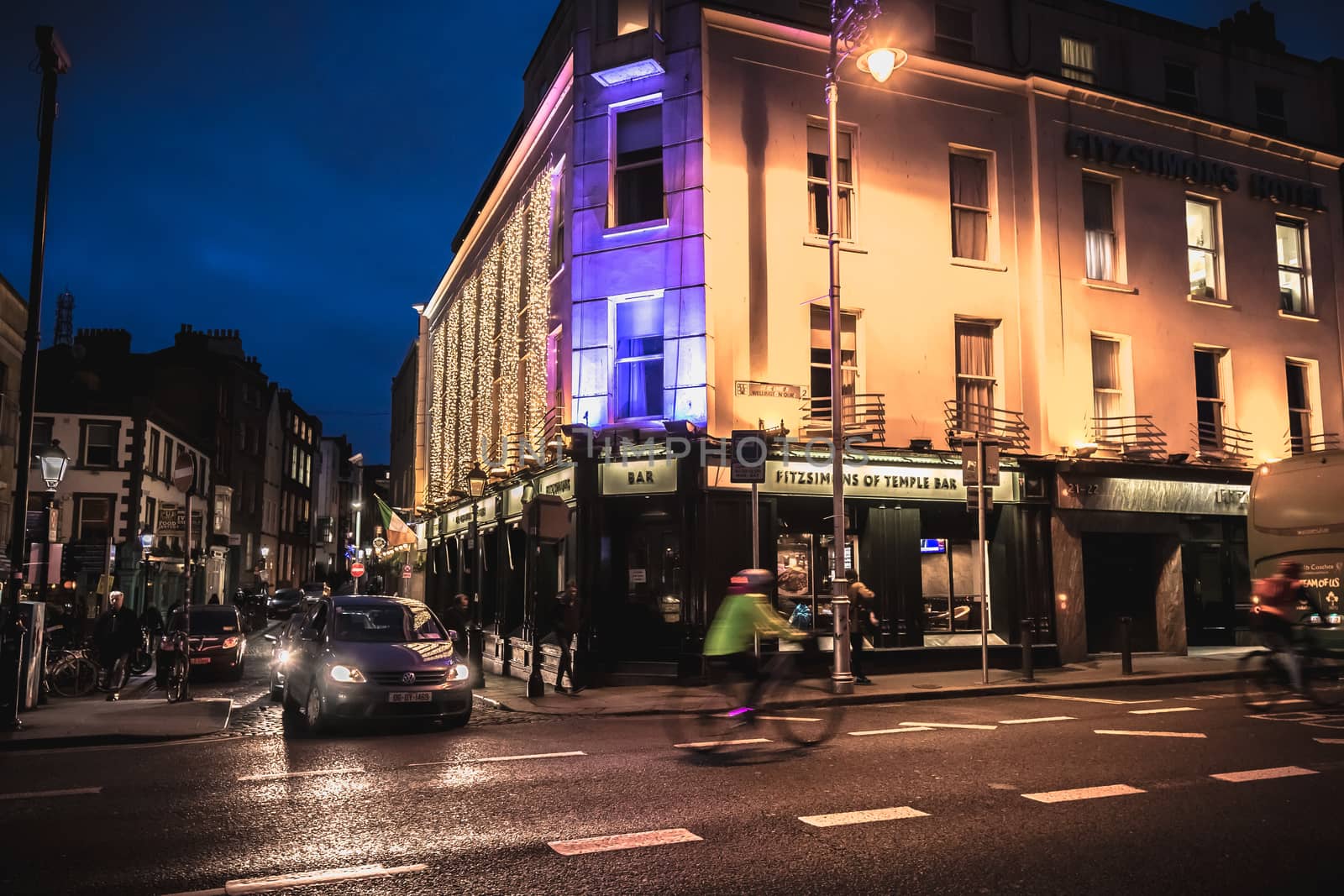 Dublin, Ireland - February 12, 2019: Night street atmosphere in the streets of the historic center where people walk on a winter day