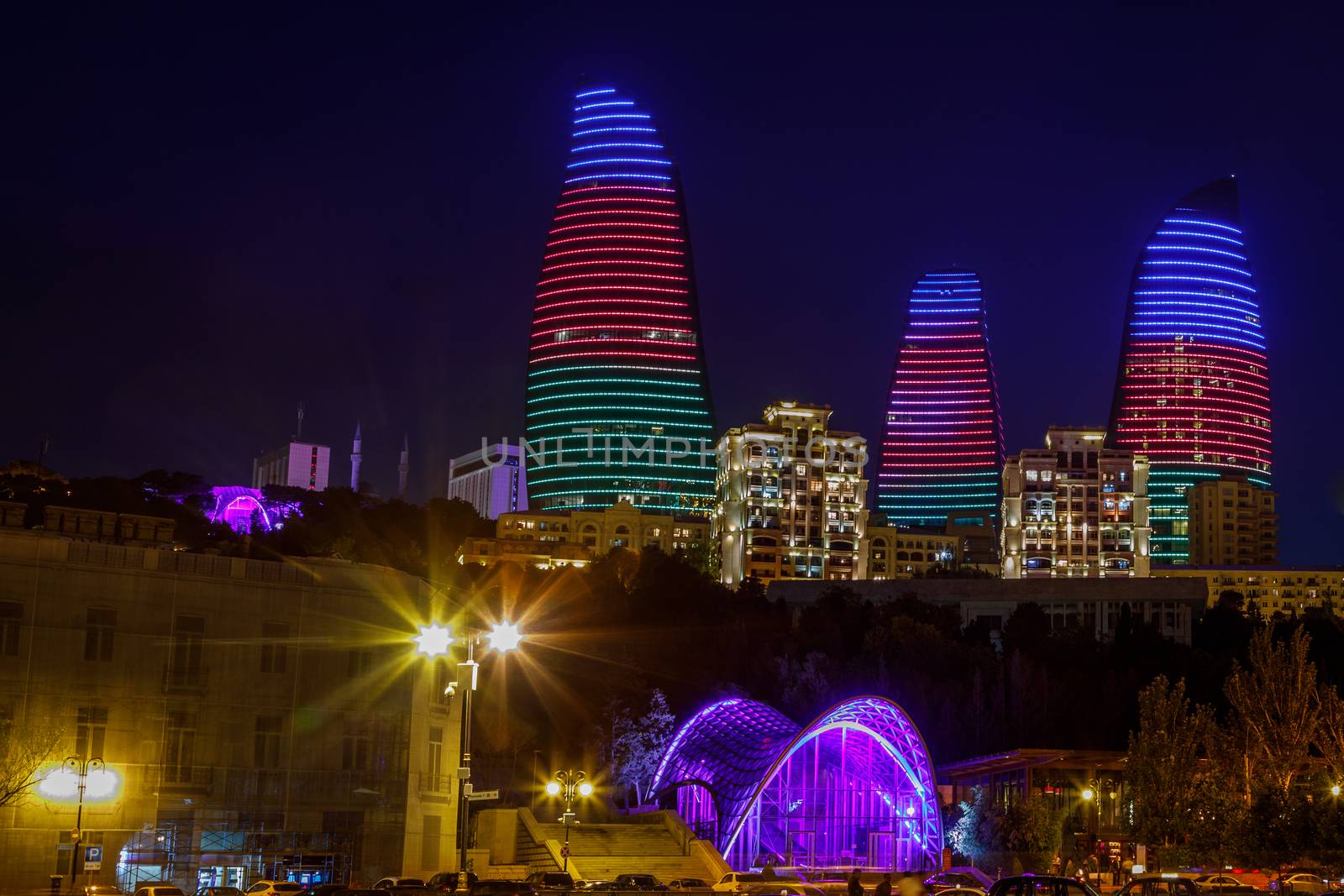 Night view of central business district with neon highlighted buildings and skyscrapers, Baku, Azerbaijan