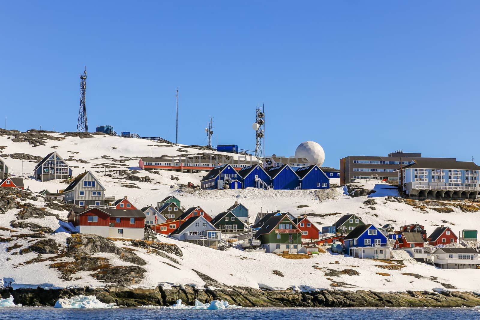 Lots of Inuit huts and colorful houses situated on the rocky coast along the fjord, Nuuk city, Greenland8