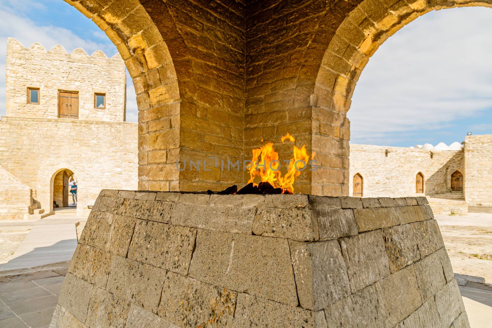 Ancient stone temple of Atashgah with burning flame inside, Zoroastrian place of fire worship, Baku, Azerbaijan